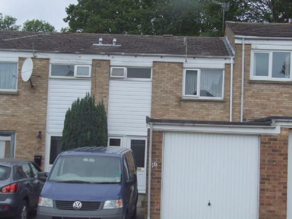 Grovehill - A spacious three bedroom terraced house in the quiet location.� The accommodation comprises entrance hall, spacious lounge/diner with patio doors into enclosed garden, cloakroom, kitchen with appliances, three good size bedrooms, bathroom with shower only, off road parking for 2 cars and a garage.� The property is located within walking distance of local schools and shops. PART-FURNISHED. Available Now. - Front
